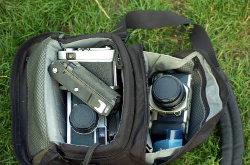Lowepro Nova 1 camera big with Canon A-1 and tons of other junk.